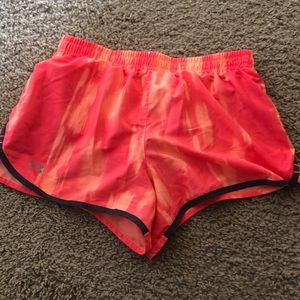 Under Armour bright orange running shorts